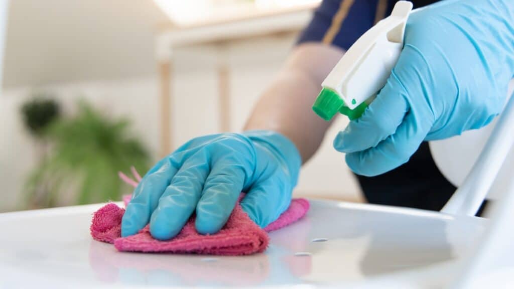 Recurring cleaning service disinfecting countertops to maintain a clean and healthy home.