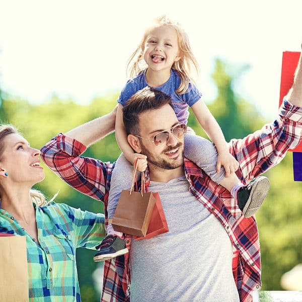 A family enjoying time outdoors after hiring a recurring maid service to clean their home.