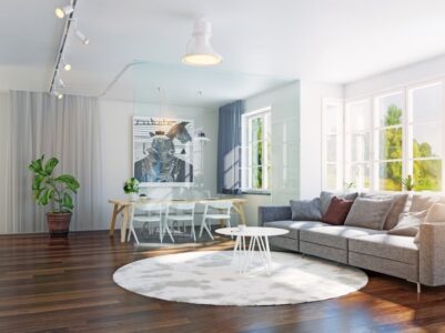 Professional maid service keeping a sunlit living room spotless.
